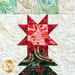 Close up of the star on top of the pine tree made with batik fabrics