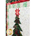 Angled close up photo of a Christmas quilt featuring a large potted pine with a star on top