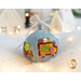 Photo of a wool felt ornament featuring a small car full of wrapped gifts, surrounded by white Christmas and winter decor.