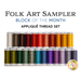 Two rows of thread spools in a rainbow of colors isolated on a white background with the words, 