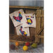Multicolor farm themed blocks staged in a wooden box with woolen easter eggs