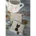 Two adorable cat blocks staged on cool wood with a vintage mug