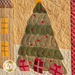 Close up of the quilted Christmas tree with wrapped gifts, angled to show the stitching detail