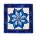 Photo of the completed quilt block featuring a pinwheel shaped snowflake made with different shades of blue fabric with a white background and dark blue border isolated on a white background