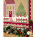 A close up on the lower right side of the wall hanging, demonstrating fabric and piecing details as well as the assorted and scattered holiday decor staged with it.