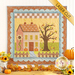 The completed Little Garden House in Autumn wall hanging in a soft autumnal palette of orange, blue, green, and yellow, hung on a white paneled wall and staged with coordinating decor with fall leaves scattered on the floor.