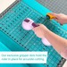 person cutting fabric using a rectangle ruler and rotary cutter
