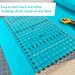 angled view of rectangle quilting ruler on turquoise fabric