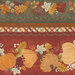 Up close border stripe fabric featuring pumpkins and leaves