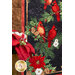 Photo of a winter themed panel quilt featuring a panel with red cardinals and poinsettias on a black background with a rustic textured border, hanging flat on a wall with poinsettias in the foreground.