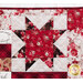 Close up of one traditional style quilt block made with red and cream fabrics