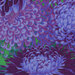 close up of Fabric featuring vibrant green, blue, and purple chrysanthemums over a green background