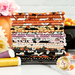 A stack of colorful Halloween-themed fabric bundles in orange, black, white, and purple.