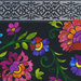 8x8 swatch of border stripe fabric featuring flowers on a black background