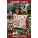 The front of the pattern showing the finished project staged amongst Christmas decor