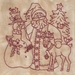 A machine embroidered Santa beside a snowman and reindeer.