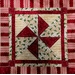 A close up of the pinwheel block featured throughout the quilt.