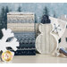 fabrics in a lovely gradient from cream to a dark, dusty blue stacked in front of a snowy scene with a snowman shaped basket
