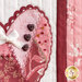 Close up photo of a pink, red, and white wall hanging featuring one of the four hearts covered in charms, buttons, and ribbons.
