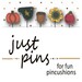 A digital mockup of the packaging edited with the real pins, showing a pumpkin, crow, acorn, sunflower, and apple.