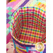 A top-down shot of the fabric basket, showing the inside of the basket, styled in a rainbow plaid fabric.
