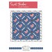 Front cover of the pattern showing a digital mockup of the completed quilt in blues, white, and red, isolated on a white background with various text graphics above and below.