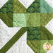 A close up on the patchwork shamrock block, showing fabric and stitching details.