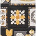Close up of one of the charming white, black, and yellow patchwork blocks.