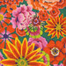 close up of Fabric featuring vibrant pink, orange, peach, and yellow flowers over a spruce green background