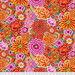 Fabric featuring vibrant pink, orange, peach, and yellow flowers over a spruce green background