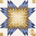 A close up of the star at the center of the medallion quilt, bursting with a color gradient going from gold to blue.