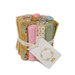 cluster of rolled up Spring fabrics in the Creating Memories fat eighth set