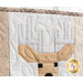 A super close up on the antlers of the deer, showing quilting and fabric details.