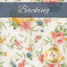 A light cream fabric with ornate tossed florals in pink, yellow, green, and blue. A navy blue banner at the top reads 