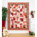 The completed Easy as ABC and 124 quilt in brilliant red, pink, and crimson. Hung on a white paneled wall, the quilt is staged with coordinating house wares like a ficus and baskets of flowers.