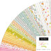 A fanned collage of green, yellow, pink, white, and light blue fabrics in the Shine Jelly Roll