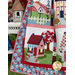 A shot of the lower left corner of the quilt, slightly draped to show flow and form, highlighting a block featuring a blue and red house with a garden pathway and tree in the yard.