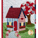 A close up on a block featuring a blue and red house with a garden pathway and red tree in the yard.