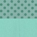 Two patterns on a light teal background: left side features dark teal polka dots, right side displays a subtle floral design.