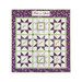 The completed Fruit of the Spirit Panel Star Quilt in white, purple, and green, isolated on a white background.