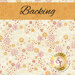 Swatch of a cream fabric with tossed, whimsical star and flower motifs in orange, pink, and white. A tangerine banner at the top reads 
