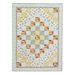 The completed quilt in pastel blues, greens, and earthy browns, isolated on a white background.