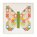 The full and completed Butterfly Patch Quilt in white and bright colors from Moda's Strawberry Lemonade collection, isolated on a white background.