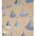 A shot of the middle of the quilt at a slight angle, demonstrating overall piecing and top quilting details. The sailboats seem to float along on the sandy brown background.