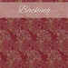 A swatch of crimson fabric with a repeating motif of tiny leaves in tonal red, sandy brown, and sandy white. A dusty pink banner at the top reads 