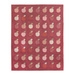 The completed Apple Cider quilt in rich shades of red, pink, and green, isolated on a white background.