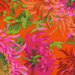 Close up of bright orange fabric with large pink, coral, and crimson florals with bright green leaves throughout