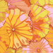Close up of bright yellow fabric with overlapping yellow, orange, and mauve lotus leaves all over