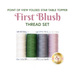 The Point of View Folded Star Table Topper First Blush 4pc Thread Set, four spools of cream, green, gray, and mauve pink thread isolated on a white background.