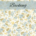 A swatch of white fabric with tossed clusters of powder blue flowers and yellow leaves and flourishes. A pale blue banner at the top reads 